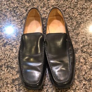 Tod’s black slip on loafers